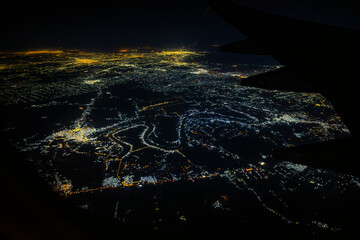 Aerial view of Baghdad city at night with Tigris river meanders, Iraq