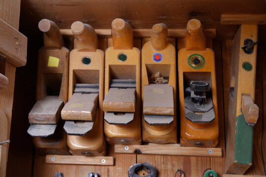 Wooden wood planers arranged in a row in a carpentry workshop