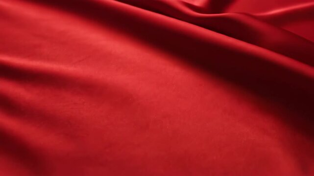 Vibrant red fabric with flowing waves and soft textures