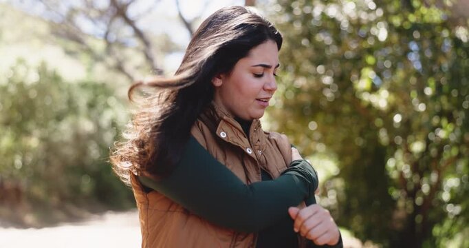 Woman, shoulder pain and hiking in forest with injury, sore muscle or massage for tendinitis on adventure. Person, trekking and joint ache with inflammation, stress or burnout with arthritis in woods