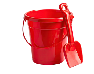 A glossy red sand bucket and shovel sit against a transparent backdrop