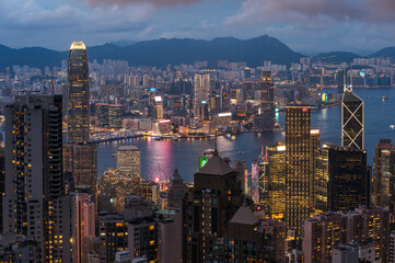 View of Hong Kong and Kowloon from Victoria peak. Evening, sunset. Panorama of Hong Kong, skyscrapers and nature. 21 May 2025, Hong Kong, China