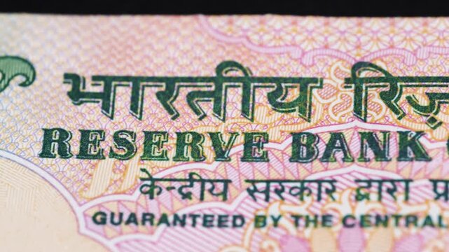 Close up view of Reserve Bank of India text on Indian Rupee bank note.
