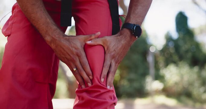 Hands, knee pain and hiking in forest with injury, sore muscle or massage for tendinitis on adventure. Person, trekking and joint ache with inflammation, fatigue or burnout with arthritis in woods