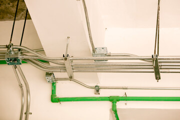 Industrial Piping System: intricate network of metal pipes and conduits crisscrossing, a study of structural architecture. Capturing the essence of construction.