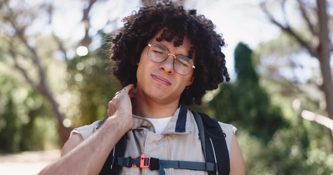 Hiking, travel and man in forest, neck pain and countryside with environment. Nature, person and hiker in woods, inflammation and anatomy problem with wellness, bruise or muscle tension with ache