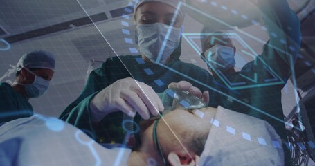 Performing surgical staff in green gowns manipulating airway mask and tube in operating room, HUD