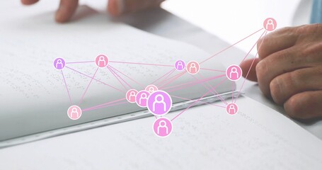 Tracing male hands in light long sleeve exploring Braille book at clean desk, with network overlay