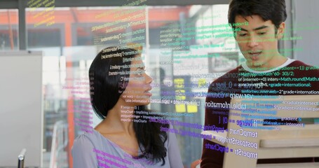 Debugging purple-top woman and green-knit man reviewing code at office with laptop, glass partition