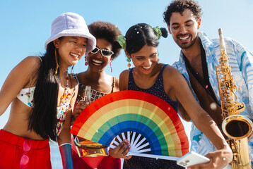 Friends at Brazilian carnival celebrating colors