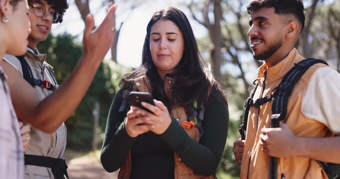 Woman, phone and friends in forest on hiking adventure, lost and problem solving for direction on vacation. People, group and smartphone with point, confused or search map on mobile app for trekking