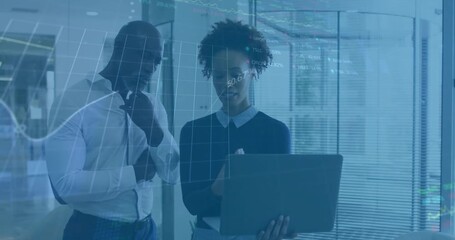 Analyzing financial data on laptop, business people with stock market animation over - Powered by Adobe