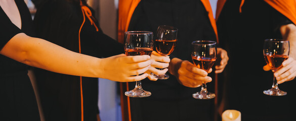 Friends enjoying a Halloween party at a bar making a toast