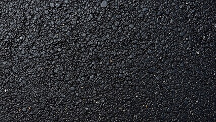 Fototapeta premium Top down view of fresh black road asphalt texture