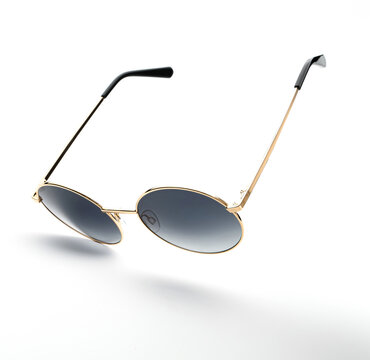 Sunglasses flying in isolation on bright background, showcasing vintage design and modern style