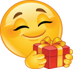 Happy Emoji Emoticon Holding a Wrapped Gift Box