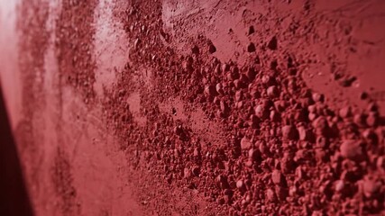 Abstract red wall texture close up with rough surface details