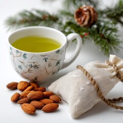 Zen Tea Moment: A serene still-life featuring a delicate cup of green tea, accompanied by roasted almonds and a charming sachet, evokes a sense of calm and well-being.