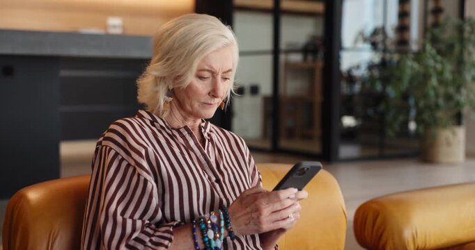 Stress, reading or senior woman with phone on couch, check notification or phishing email for pension scam. Worry, suspicious link or old person with mobile in home, retirement info request or scroll