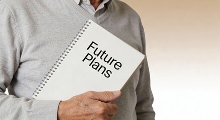Person holding a notebook titled "Future Plans". ,Active aging Finance concept.