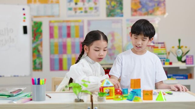 Children Collaborating With Colorful Building Blocks in Classroom