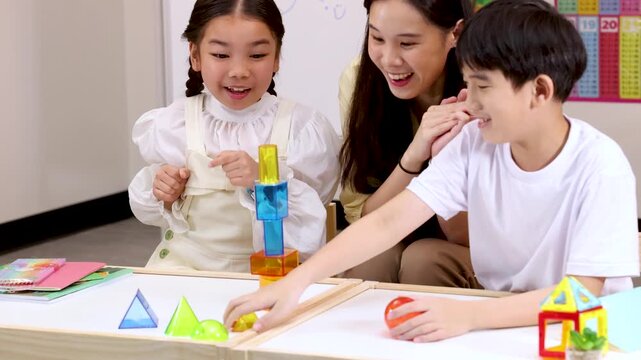 Children Building Colorful Blocks with Teacher in Classroom Activity