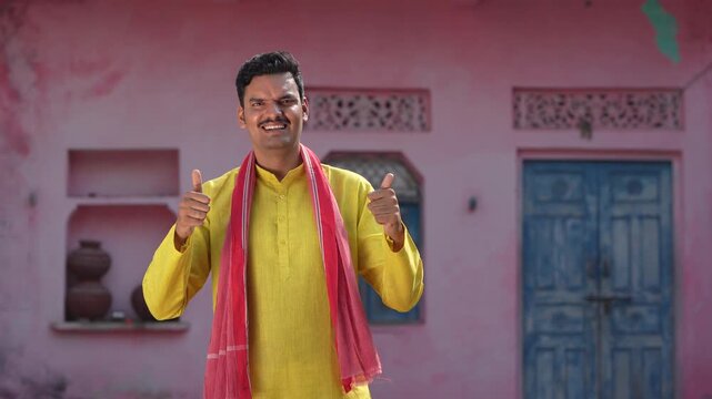 happy indian farmer showing thumps up 