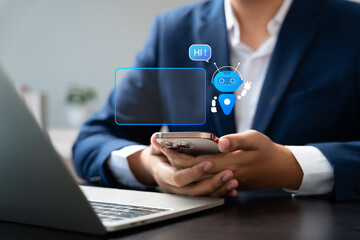 Businessman interacts with AI chatbot on laptop, Automated conversations in digital business. Concept includes virtual support, Customer communication, Smart service through artificial intelligence.