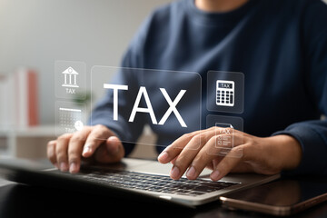 Tax and Vat concept. Government, state taxes concept. Businesman using calculator and laptop to complete Individual income tax return form online for tax payment. Data analysis, financial research.