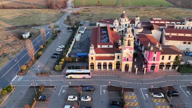 Aerial view of Fidenza Village luxury outlet shopping center parking lot in Italy