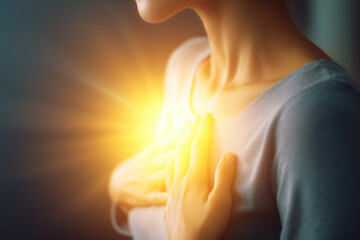 Emotional healing inner peace awellness journey concept. A warm, glowing light emanates from a person's chest in comfort