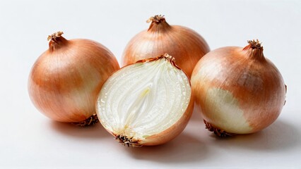 Whole and sliced yellow onions on white background