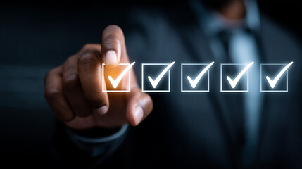 Hand touching glowing white checkmark icon for completion or approval