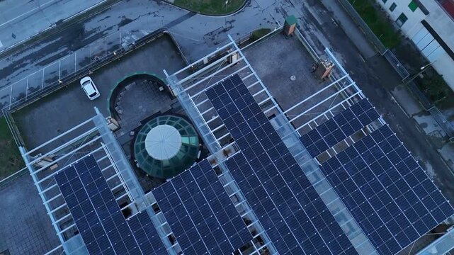 Lombardy Italy multi-storey building solar panel array rooftop renewable energy sustainable facility