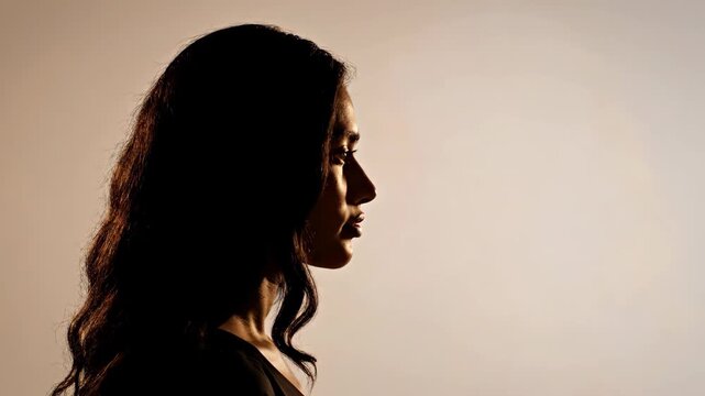 Silhouette profiles of diverse women in a beauty montage. Side view of female faces with different hairstyles in shadow. Diversity and identity concept with copy space