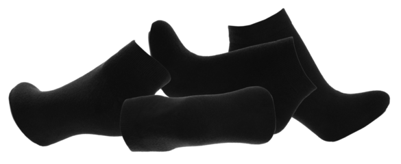 four black ankle socks artfully arranged in a slightly overlapping cluster on a plain white background, highlighting their soft texture and simple design for daily wear.