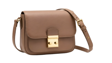 A shoulder bag with a rectangular flap, tan leather, and gold hardware against a dark background