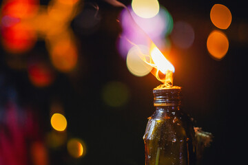 bottle with  candle inside of it