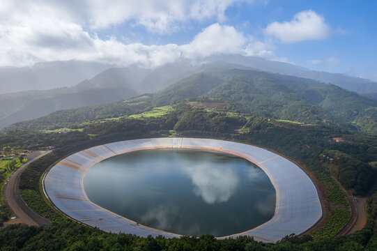 Aerial view of Barlovento Lagoon in La Palma island, a circular reservoir in mountains of the Canary Islands.