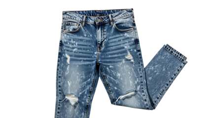 Torn, faded, paint-splattered denim jeans lie flat, showcasing pockets and distressing