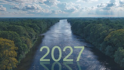 Aerial view river flowing through green forest toward horizon with clouds and sunbeams
