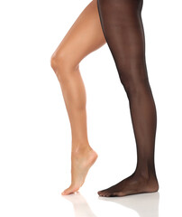 Studio shot of a woman&rsquo;s legs with one bare foot on tiptoes and the other in sheer black pantyhose, shown in elegant pose on a white background