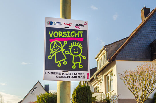 ISERLOHN, GERMANY &mdash; JANUARY 6 2026: child safety warning sign with message &ldquo;Unsere kids haben keinen airbag&rdquo; displayed on residential street