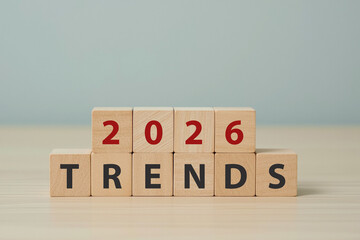 2026 trend concept. Wooden cube with 2024 and TRENDS text. Beautiful grey background, copy space. Used for banner in trend concept in new year for monitoring new business opportunities. 