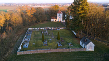 Aerial view of St. Wenceslaus Church in Habrina, Czech Republic, at golden hour.