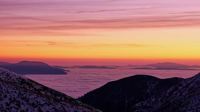 Winter Mountain Peaks above Cloud Inversion at Evening Dusk