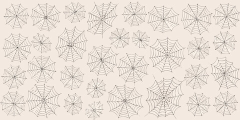 A dense pattern of detailed spiderwebs covering a light beige background