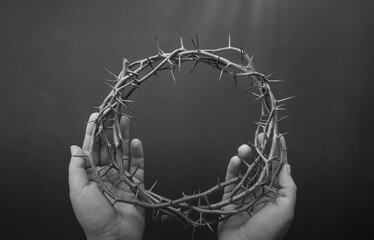 crown of thorns on hands easter background