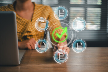 Professional woman using a digital interface with document icons and a green checkmark, symbolizing approval and efficiency.