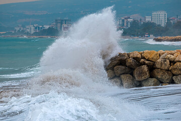 waves crashing on rocks near the sea	